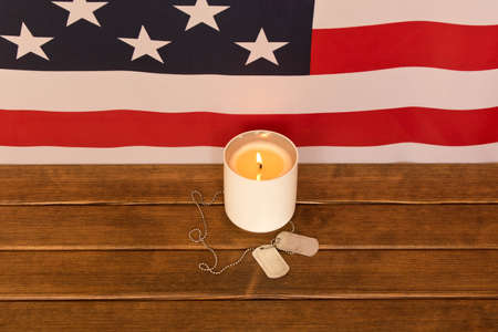 American flag and army tokens on memorial day  . On wooden backgroundの写真素材