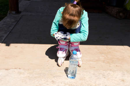 Girl on roller skates . The concept of a healthy lifestyle .
