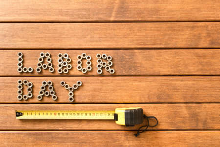 Labor day. Different tools on wooden background の写真素材