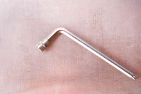 Socket wrench on the metal table . Labor day .