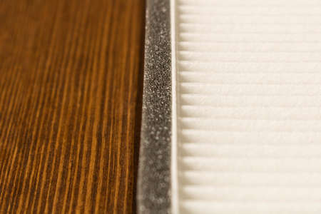 New car interior filter on wooden table.の写真素材