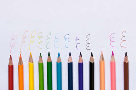 Set of colored pencils on a sheet of paper の写真素材