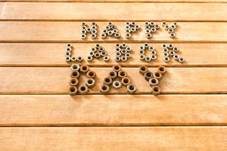 Labor day.  Different tools on a wooden table .の写真素材