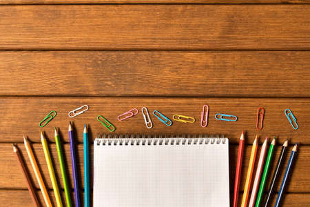 Various school supplies on wooden background. Concept of education. A blank text space.の写真素材