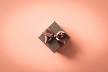 A small gift on a light background. The concept of a gift made with your own hands.の写真素材