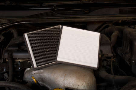 New and old car air filter. Close up.