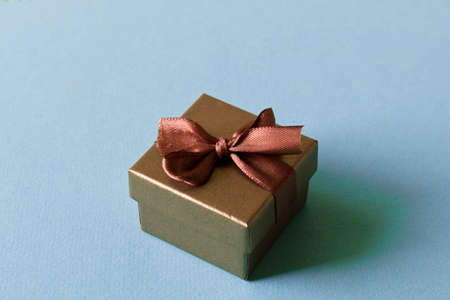 A small gift on a light background. The concept of a gift made with your own hands.の写真素材