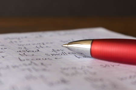 Pen and notebook in English at the school Desk. The concept of education.の写真素材