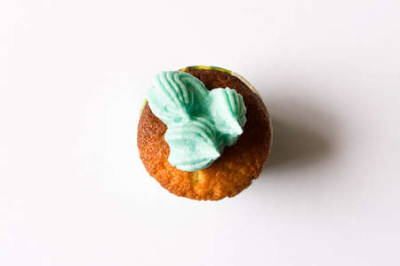 Delicious fresh cupcake. Isolated on white background. The concept of cooking with your hands.