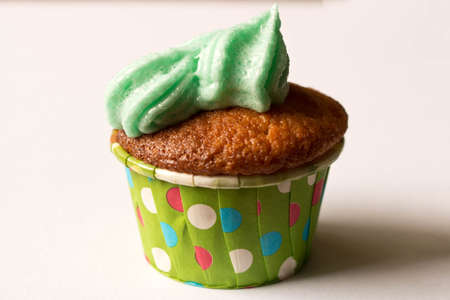 Delicious fresh cupcake. Isolated on white background. The concept of cooking with your hands.