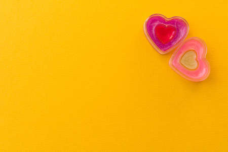 Two funny hearts on a yellow background. The concept of Valentine's day.の写真素材