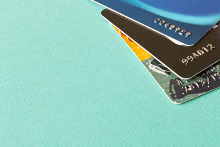 Stack of credit cards . Isolated on light background. Empty text spaceの写真素材