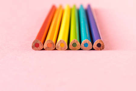 Colored pencils isolated on pink background. LGBT people of colorの写真素材