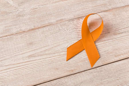 Orange ribbon. Healthcare and medicine concept. Multiple Sclerosis awareness. Leukemia awareness. Empty text spaceの写真素材