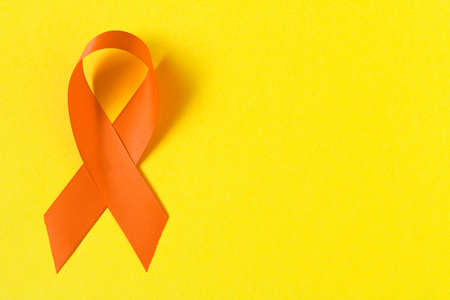 Orange ribbon. Healthcare and medicine concept. Multiple Sclerosis awareness. Leukemia awareness. Empty text spaceの写真素材