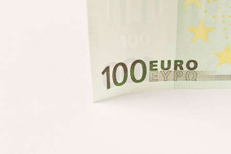 100 Euro banknote on a light background. Close up. The concept of savings
