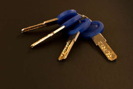 Multiple keys on dark background. Security concept