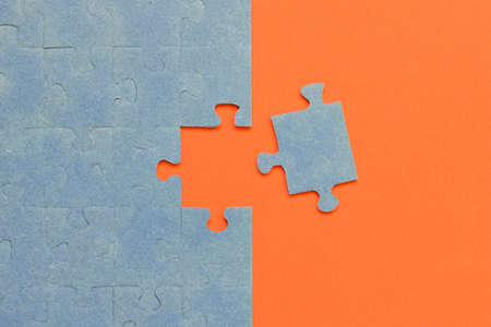 Abstract background of many puzzles on an orange background. The concept of teamworkの写真素材