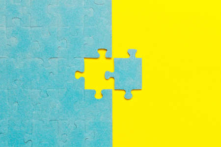 Abstract background of many puzzles on an yellow background. The concept of teamworkの写真素材