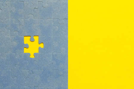Abstract background of many puzzles on an yellow background. The concept of teamworkの写真素材