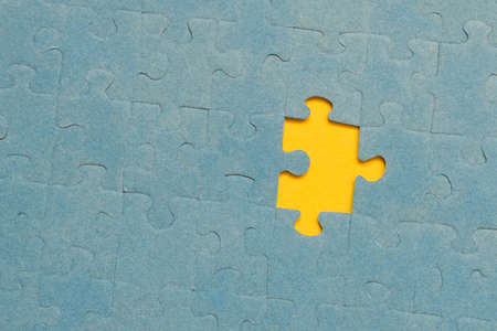 Abstract background of many puzzles on a yellow background. The concept of teamworkの写真素材