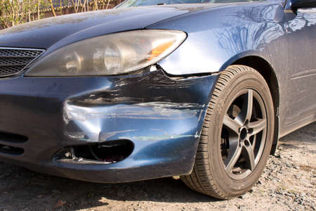 Damaged car.  Broken front bumper. The concept of road safety. Close upの写真素材