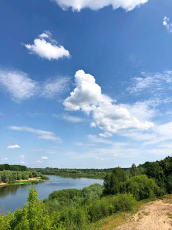View of the river and the blue sky with clouds from the railway bridgeの写真素材