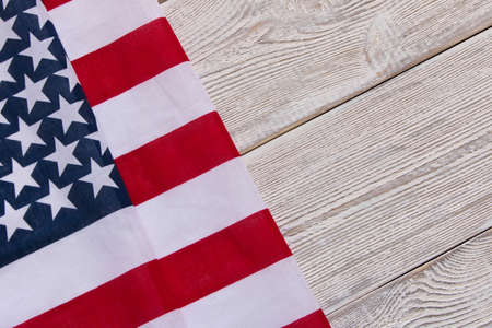 American flag on a wooden background. The concept of freedom and patriotism