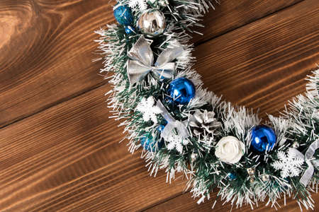 Beautiful Christmas wreath on wooden background. The concept of Christmas.の写真素材