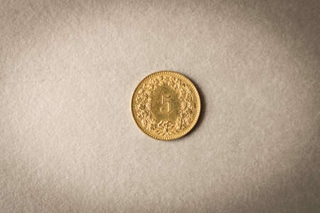 Gold coin on grey background. Close upの写真素材