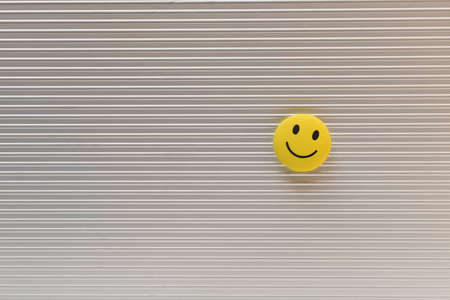 Funny smiley face on silver background. Positive mood concept.の写真素材