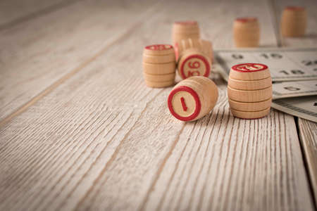 Play bingo or Lotto on a wooden table. Concept of Board gamesの写真素材