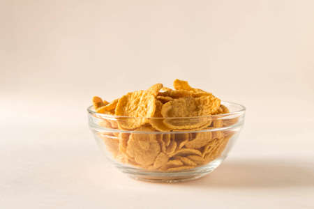 Cornflakes in a plate on a light background. Selective focusの写真素材