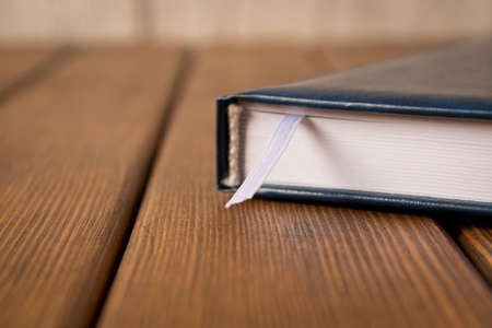 Notepad on the wooden table. Business supplies. Close upの写真素材