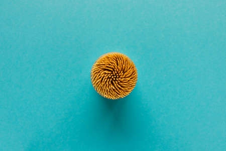 Lots of wooden toothpicks on a blue background. Abstract background for the design. The view from the topの写真素材