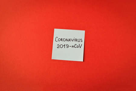 Coronavirus. Sticker with the inscription coronavirus on a red background. The concept of protection from the virus. Selective focus.の写真素材