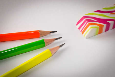 Colorful eraser and simple pencils on a light background. Close up. Selective focusの写真素材