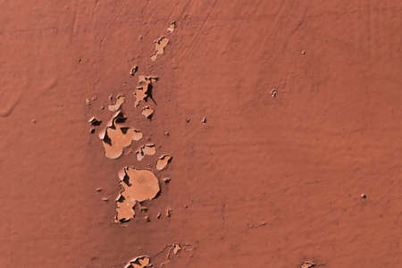 Cracked paint on the metal gate. Close up