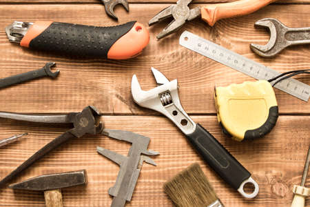 Labor day. Various tools on a wooden tableの写真素材