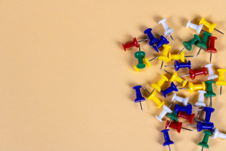 Multicolored push pins on the light background. Close up. Selective focusの写真素材