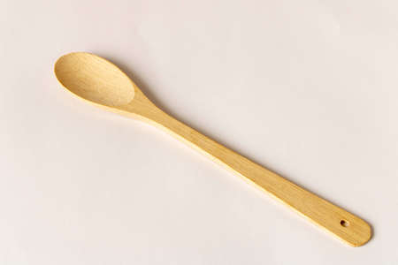 Wooden spoon on a light background. Close-upの写真素材