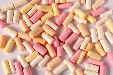 Colorful marshmallows on a light background. Close-up. Selective focus