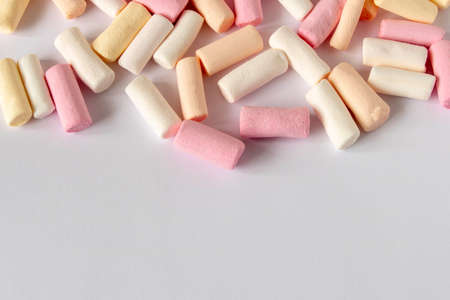 Colorful marshmallows on a light background. Close-up. Selective focus