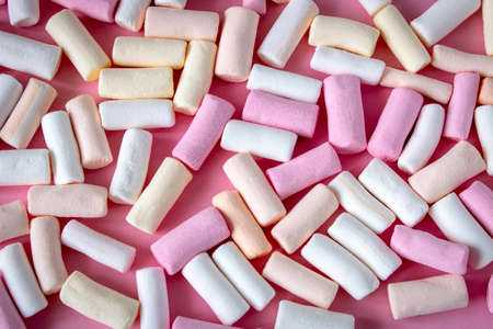 Colorful marshmallows on a pink background. Close-up. Selective focusの写真素材