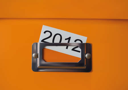 Orange storage box with the inscription 2012