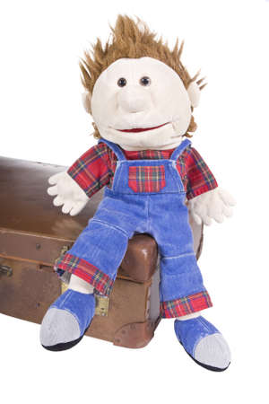 Hand puppet with suitcase over white backgroundの写真素材