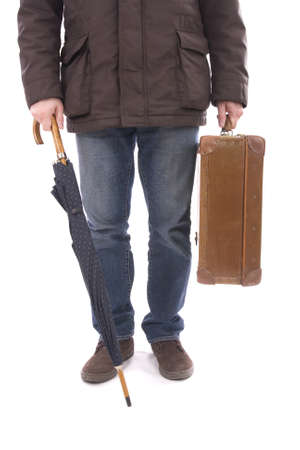 Man holding old suitcase and umbrella on whiteの写真素材