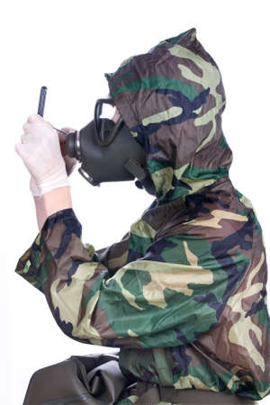 Man in a rubber hazmat holding a counterの写真素材