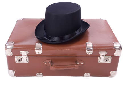 Vintage suitcase with hat over white backgroundの写真素材