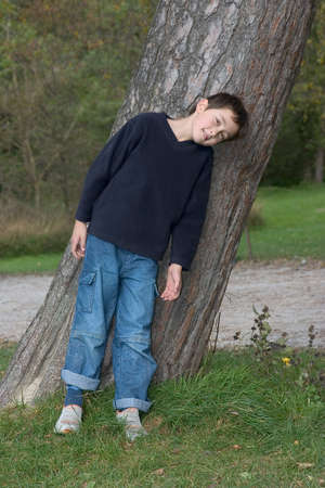 smiling teenager in the parkの写真素材